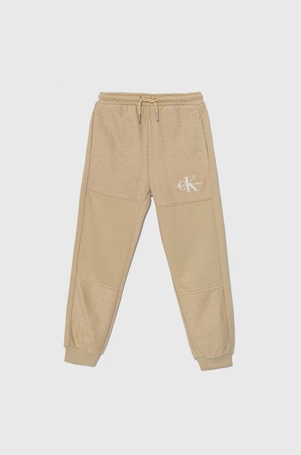 Calvin Klein Jeans Dječji donji dio trenirke Calvin Klein Jeans TERRY JOGGER boja: bež, bez uzorka, IB0IB02119