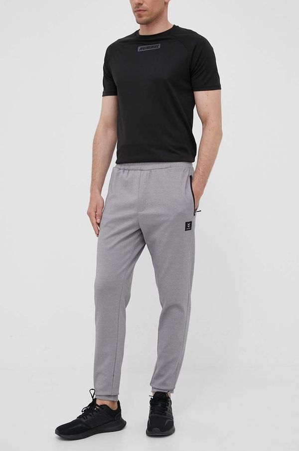 Hummel Donji dio trenirke Hummel Interval boja: siva, glatki materijal