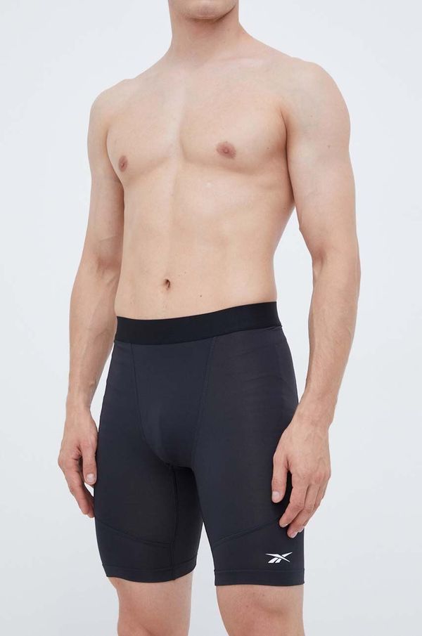 Reebok Kratke hlače za trening Reebok boja: crna