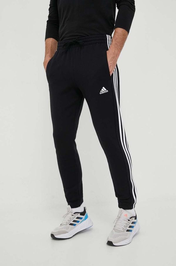 adidas Pamučni donji dio trenirke adidas boja: crna, s aplikacijom