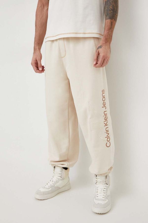 Calvin Klein Jeans Pamučni donji dio trenirke Calvin Klein Jeans boja: bež, s aplikacijom